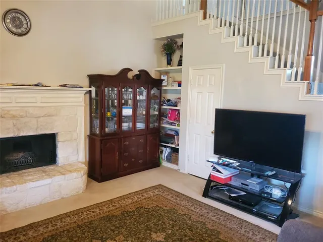 a living room with furniture and a rug