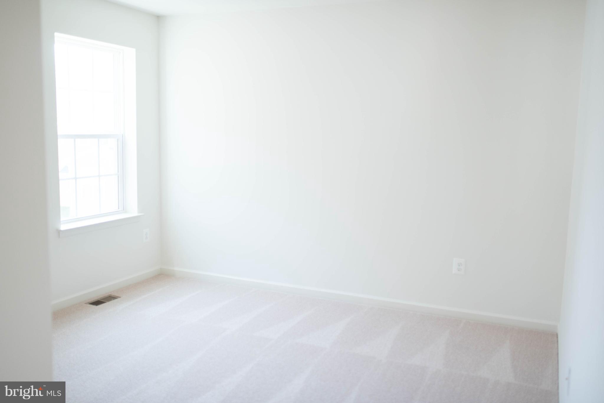 976 Morgan Run Road Middle River, MD 21220 - Photo 3 of 6 a view of an empty room with a window