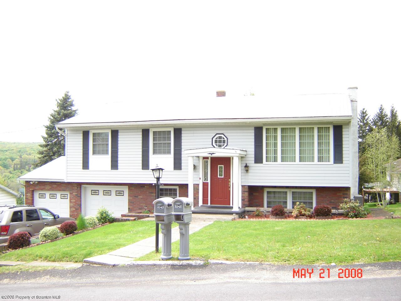 2343 T Rte 720 Moscow, PA 18444 - Photo 1 of 16 a view of a house with a yard and front view of a house