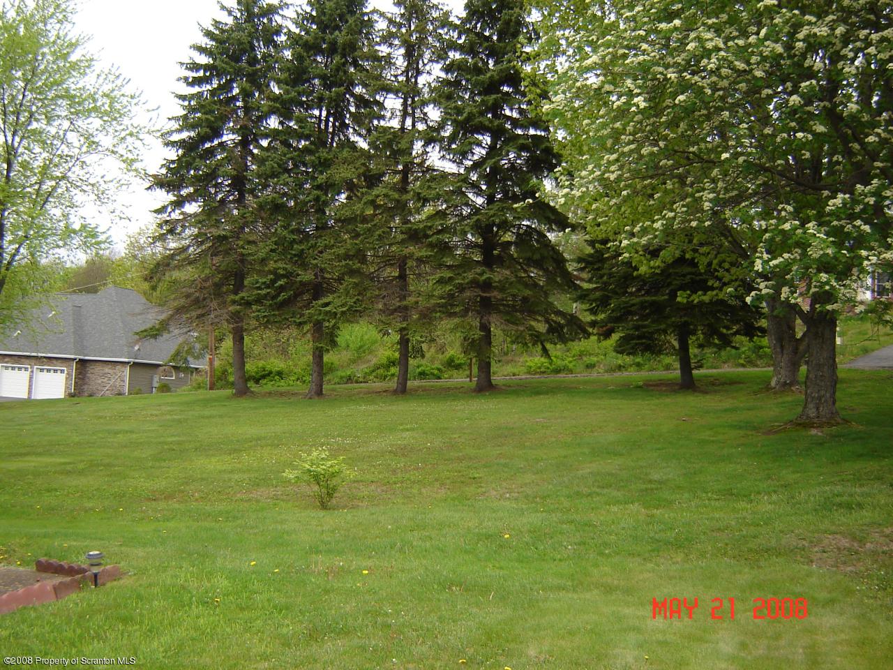 2343 T Rte 720 Moscow, PA 18444 - Photo 15 of 16 a backyard of a house with lots of green space and fountain