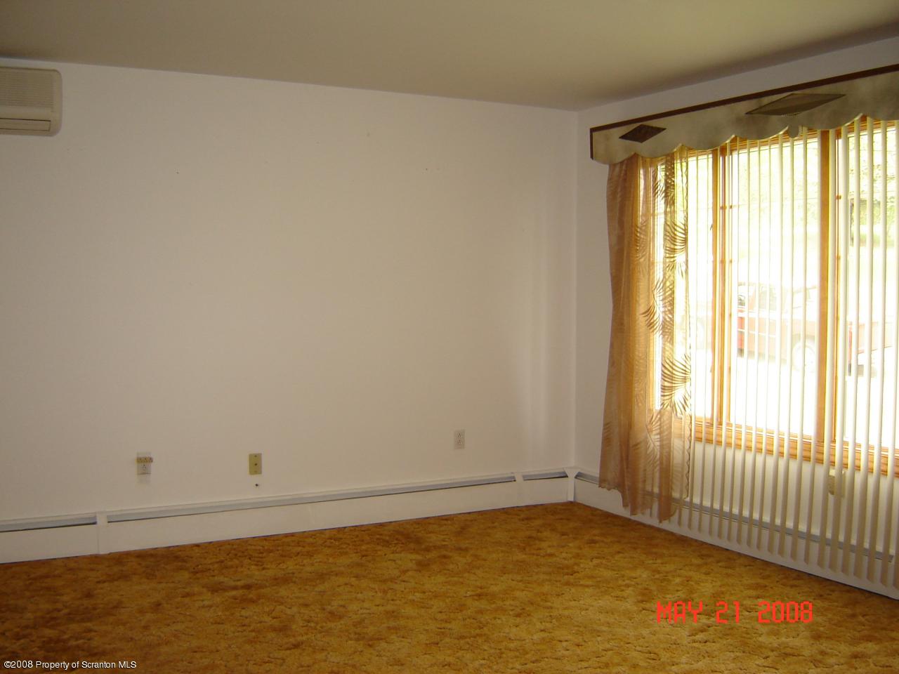 2343 T Rte 720 Moscow, PA 18444 - Photo 4 of 16 a view of an empty room with a window