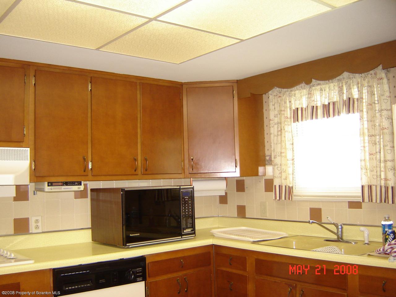 2343 T Rte 720 Moscow, PA 18444 - Photo 7 of 16 a kitchen with a sink and a stove top oven