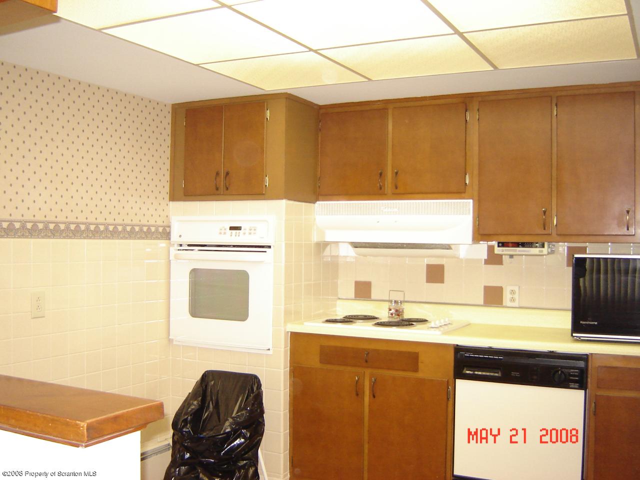 2343 T Rte 720 Moscow, PA 18444 - Photo 8 of 16 a kitchen with a stove a sink and a microwave