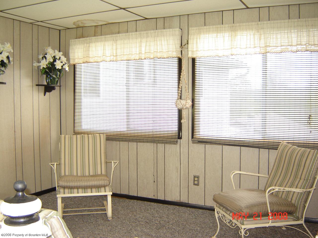 2343 T Rte 720 Moscow, PA 18444 - Photo 9 of 16 a living room with a window and a table