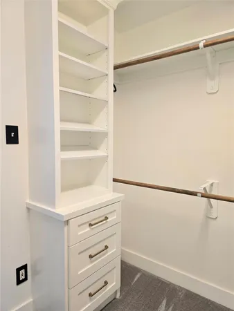 a bathroom with a double vanity sink toilet and a mirror