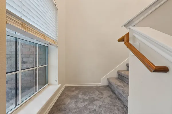 an aerial view of a house with a garden and swimming pool