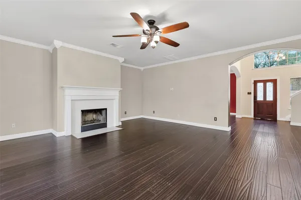 a kitchen with stainless steel appliances a stove a sink dishwasher and a refrigerator with wooden floor