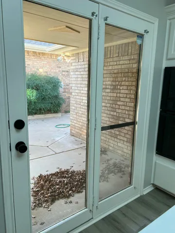 a bathroom with a glass door shower and a sink
