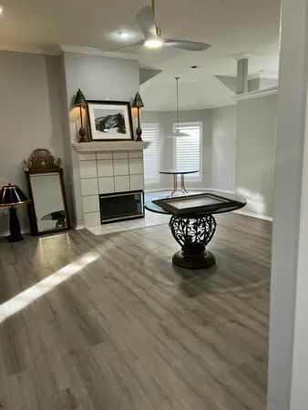 a living room with furniture and a fireplace