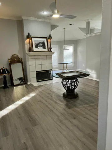 a living room with furniture and a fireplace