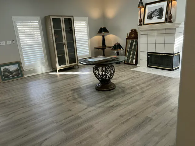 a view of a livingroom with furniture and a fireplace