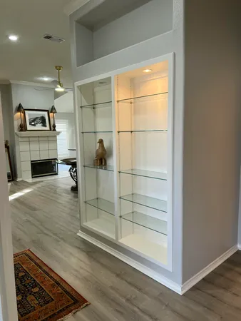 a open kitchen with a white countertops and cabinets