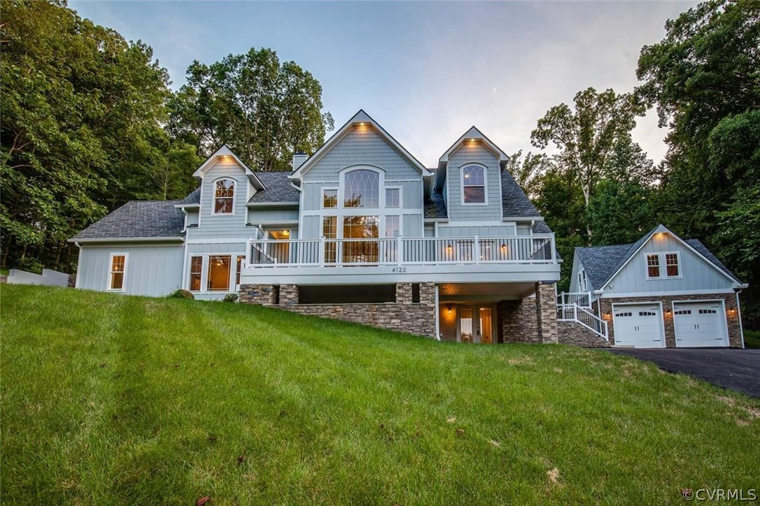 4120 East Old Gun Road Midlothian, VA 23113 - Photo 1 of 25 a front view of a house with a yard and trees