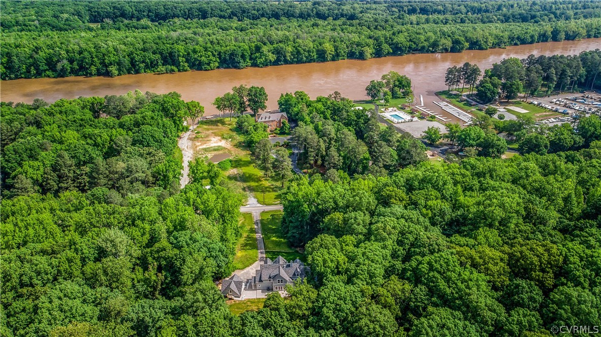 4120 East Old Gun Road Midlothian, VA 23113 - Photo 7 of 25 an aerial view of lake residential house with outdoor space and trees around