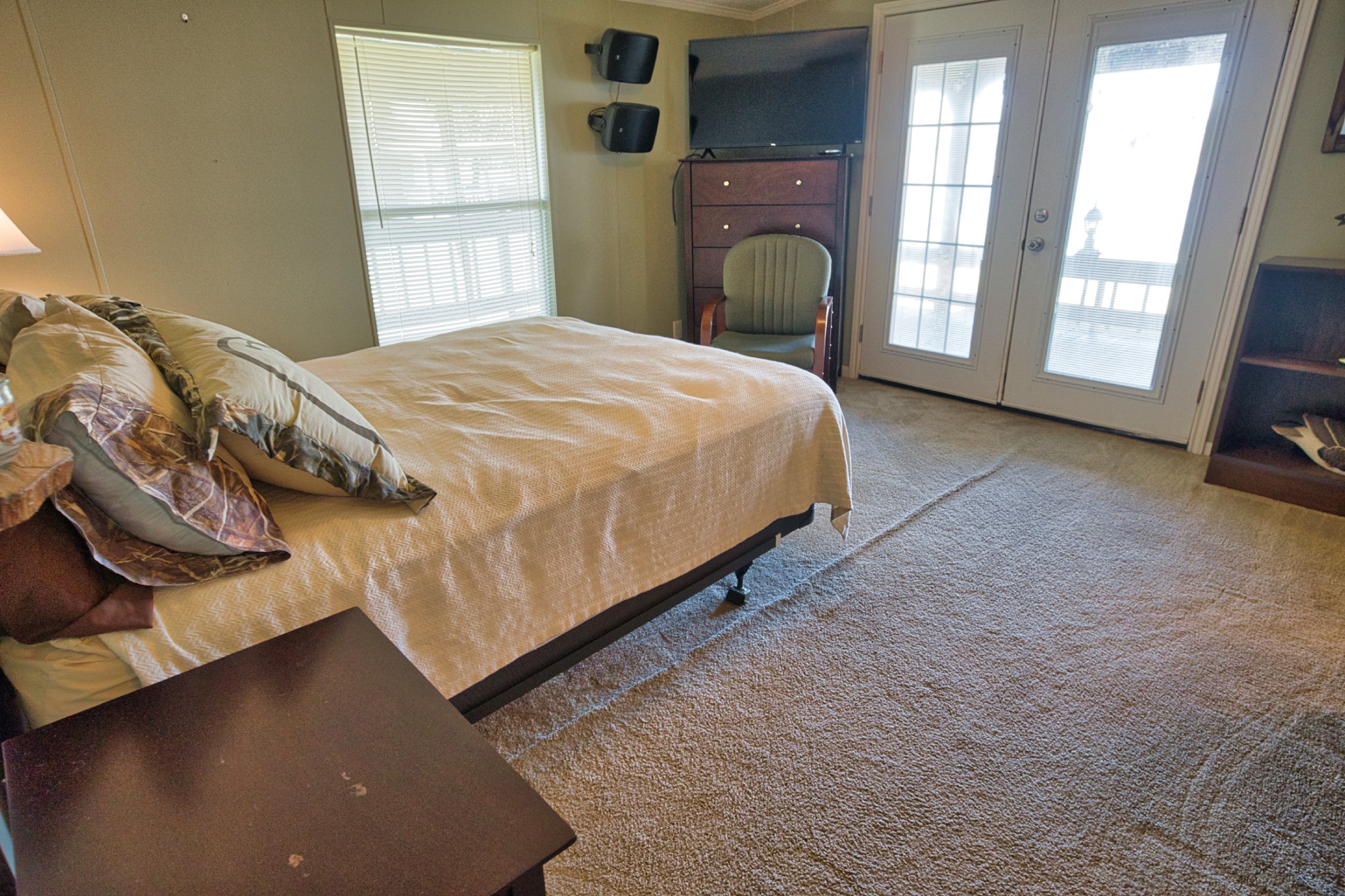 5582 County Road 469 Brazoria, TX 77422 - Photo 14 of 32 a bed sitting in a bedroom next to a window