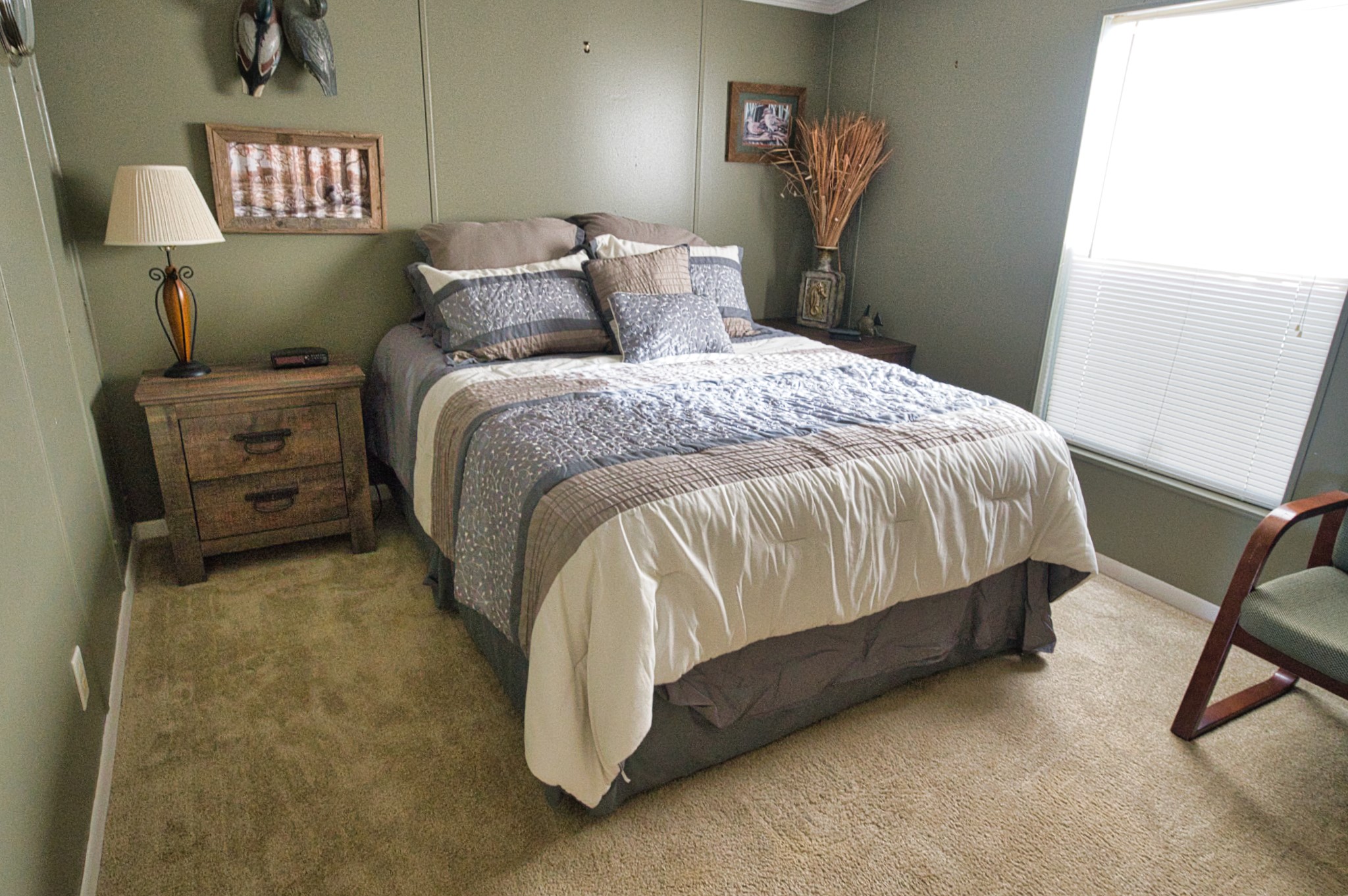 5582 County Road 469 Brazoria, TX 77422 - Photo 18 of 32 a bed sitting in a bedroom next to a window