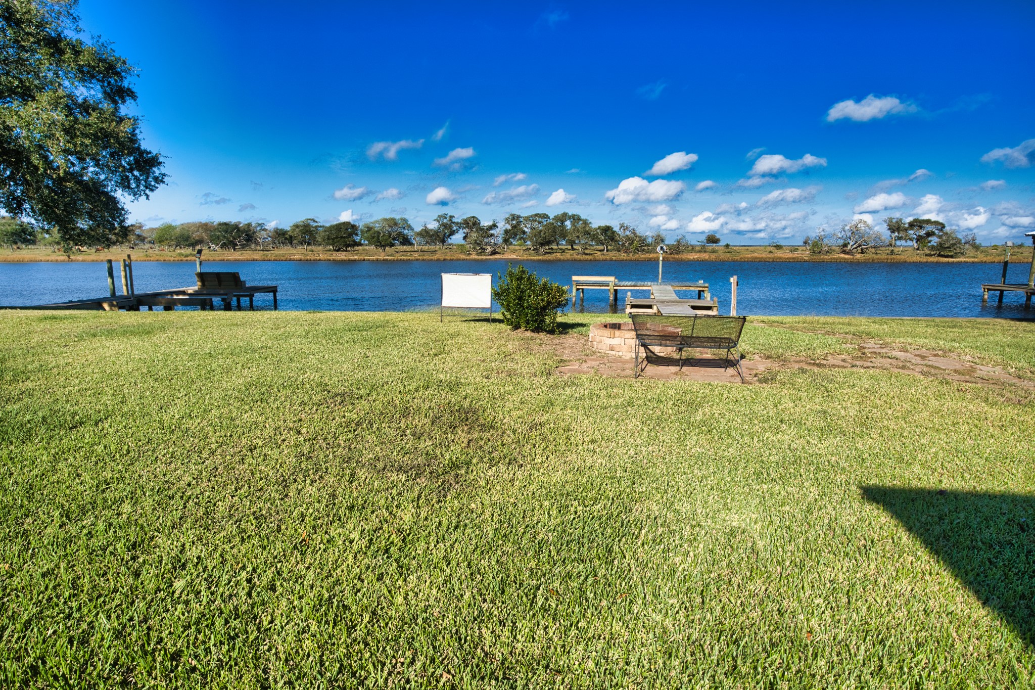 5582 County Road 469 Brazoria, TX 77422 - Photo 2 of 32 a view of a lake with houses in the back