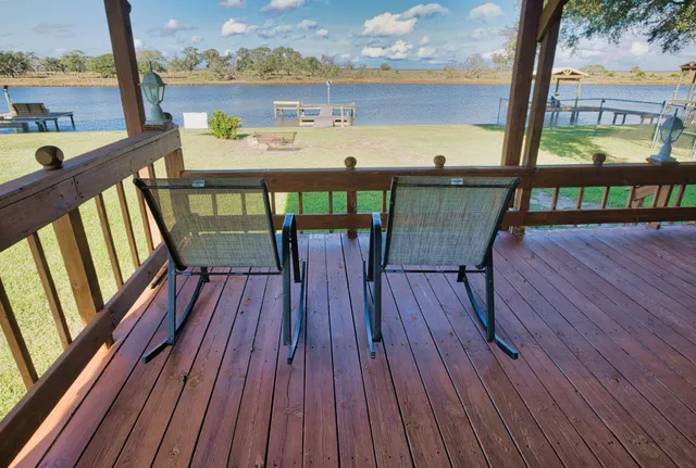 a view of a balcony with wooden floor