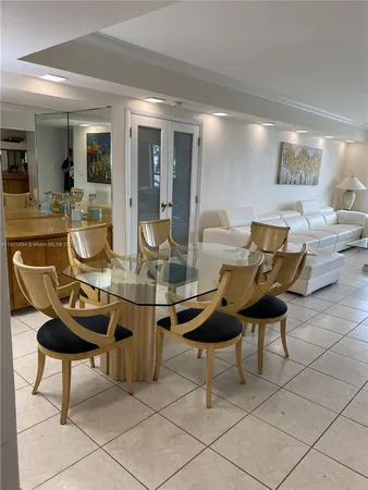 a room with table and chairs