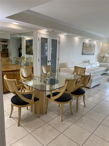 a room with table and chairs