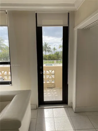 a view of an empty room with windows