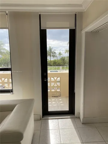 a view of an empty room with windows