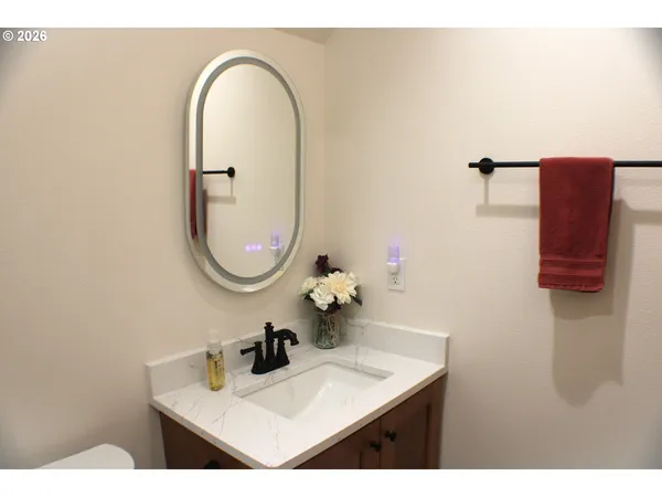 a en suite bathroom with double vanity sinks and a mirror