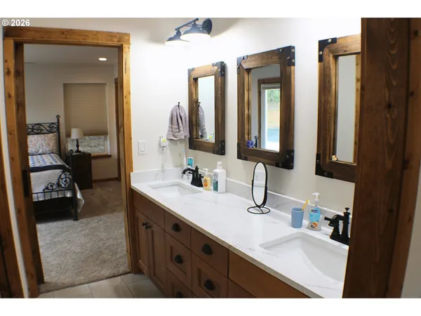 a bathroom with a window and a shower
