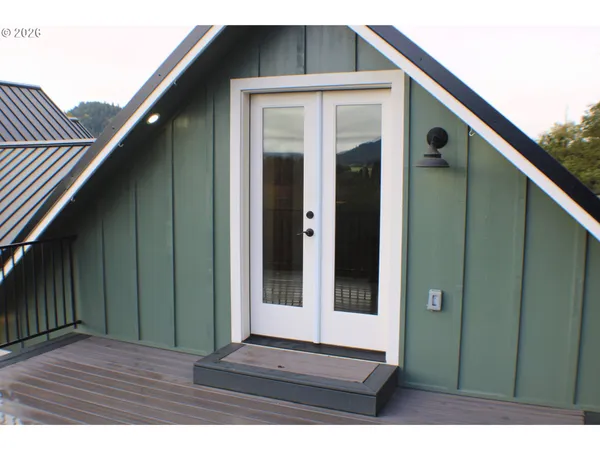 a kitchen with stainless steel appliances granite countertop a sink refrigerator and cabinets