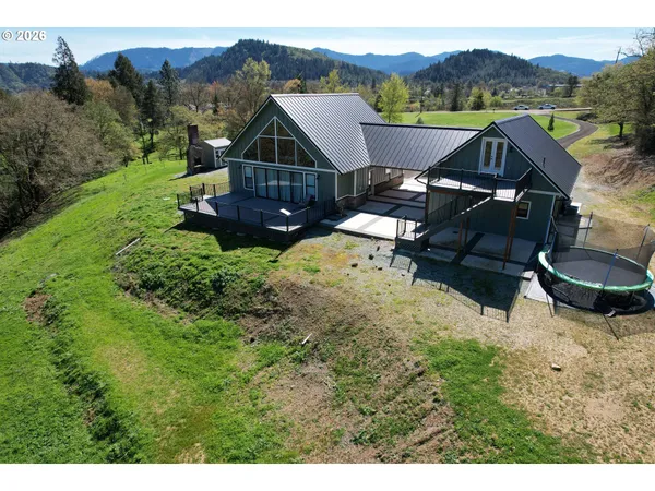 a view of a house with a mountain in the background
