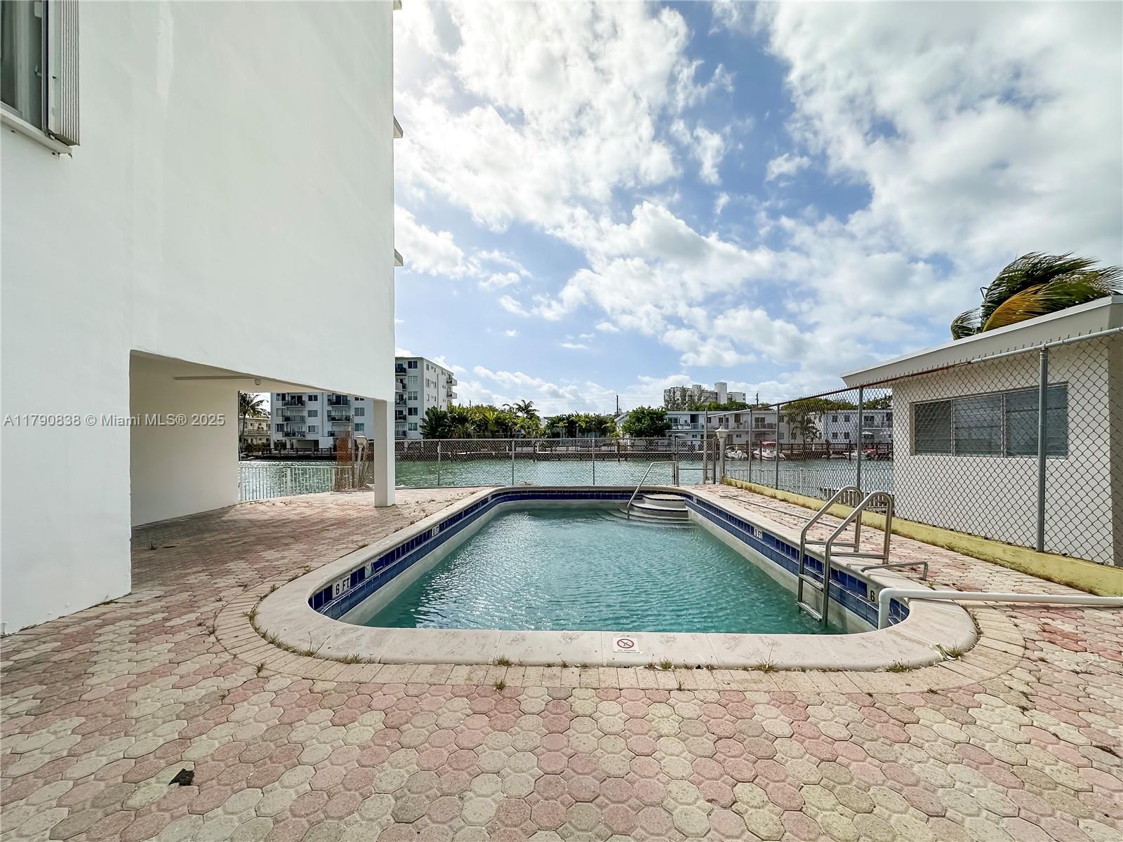 8001 Crespi Boulevard, Unit 7A Miami Beach, FL 33141 - Photo 24 of 25 a view of swimming pool with seating area