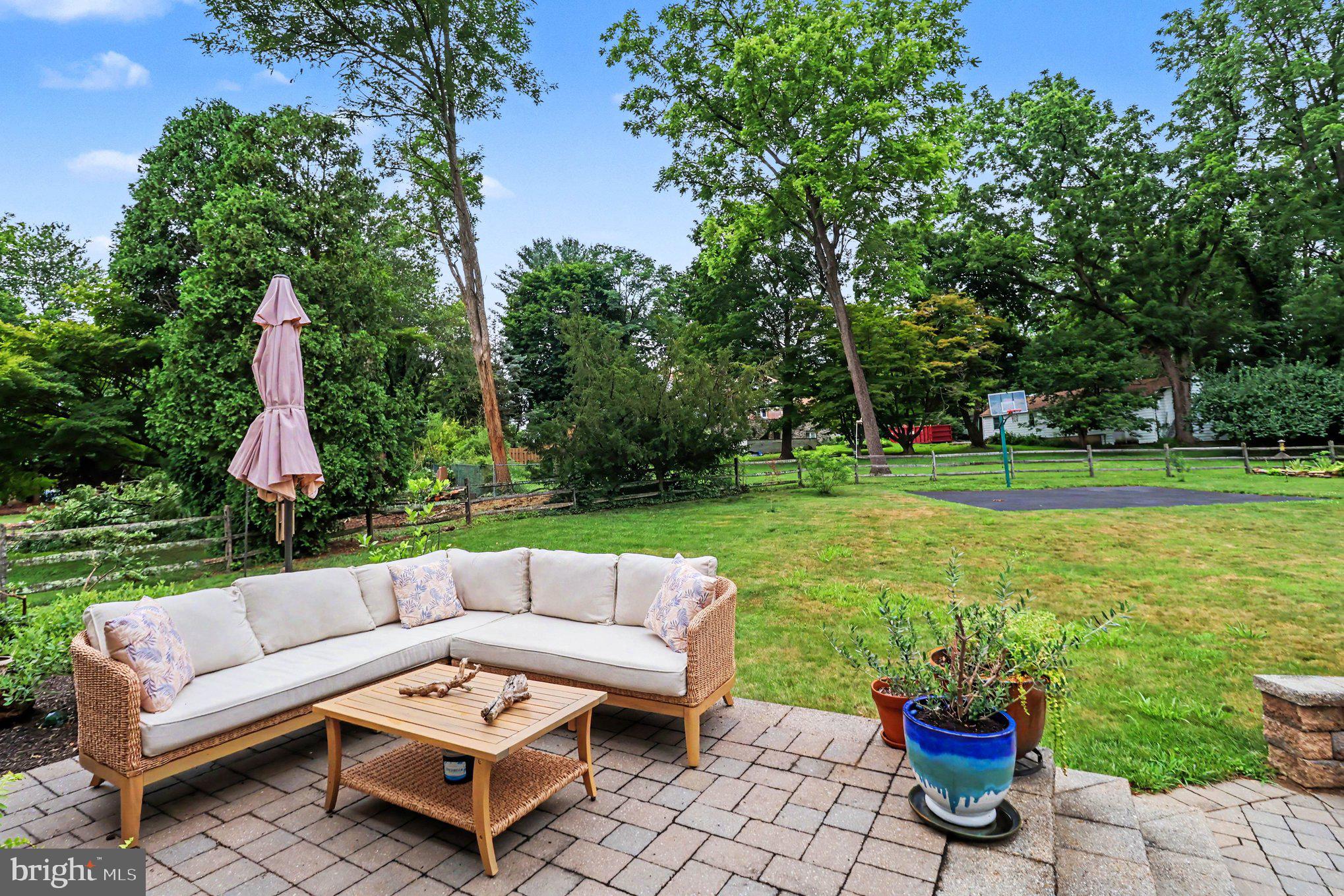 25 East Knowlton Road Media, PA 19063 - Photo 59 of 73 a view of a patio with couches potted plants and a big yard