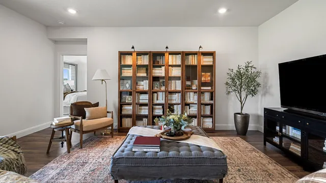a living room with furniture fireplace and a flat screen tv