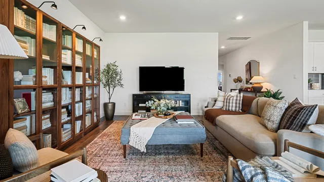 a kitchen with stainless steel appliances kitchen island granite countertop a refrigerator and a stove top oven
