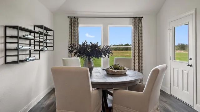 a bed room with a bed and a chair