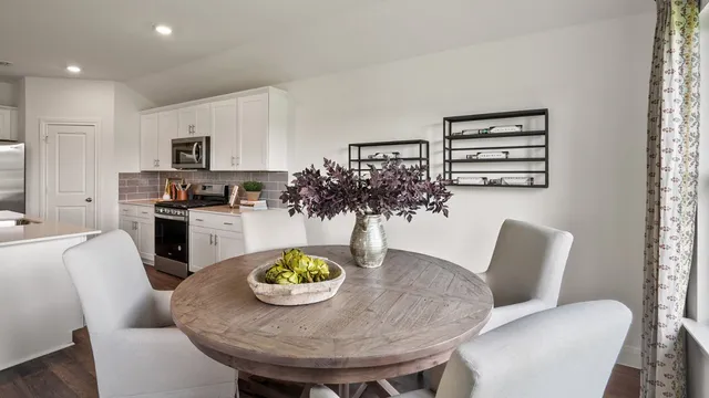 a bathroom with a granite countertop toilet sink and mirror