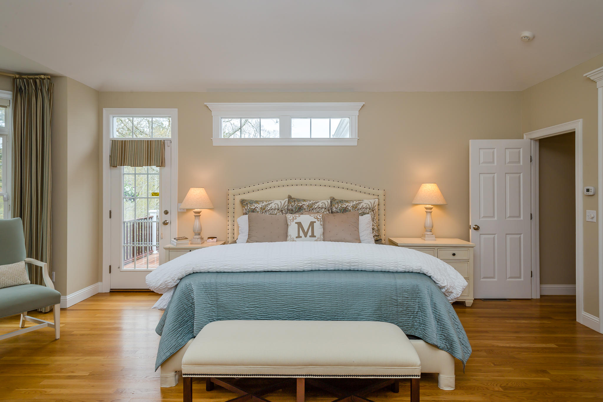 85 Palmer Road Mashpee, MA 02649 - Photo 14 of 38 a bedroom with a bed a window and wooden floor