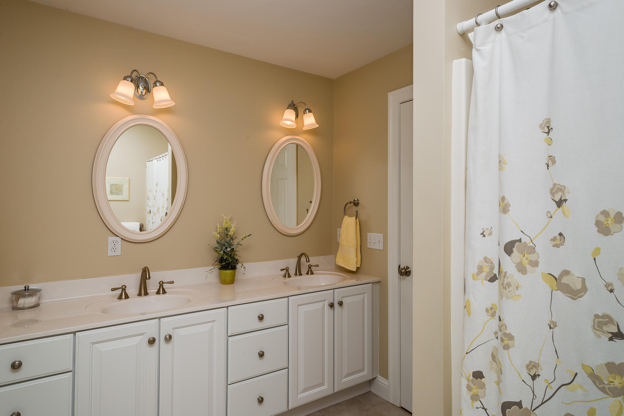 85 Palmer Road Mashpee, MA 02649 - Photo 25 of 38 a bathroom with double vanity sinks a toilet a mirror and a shower