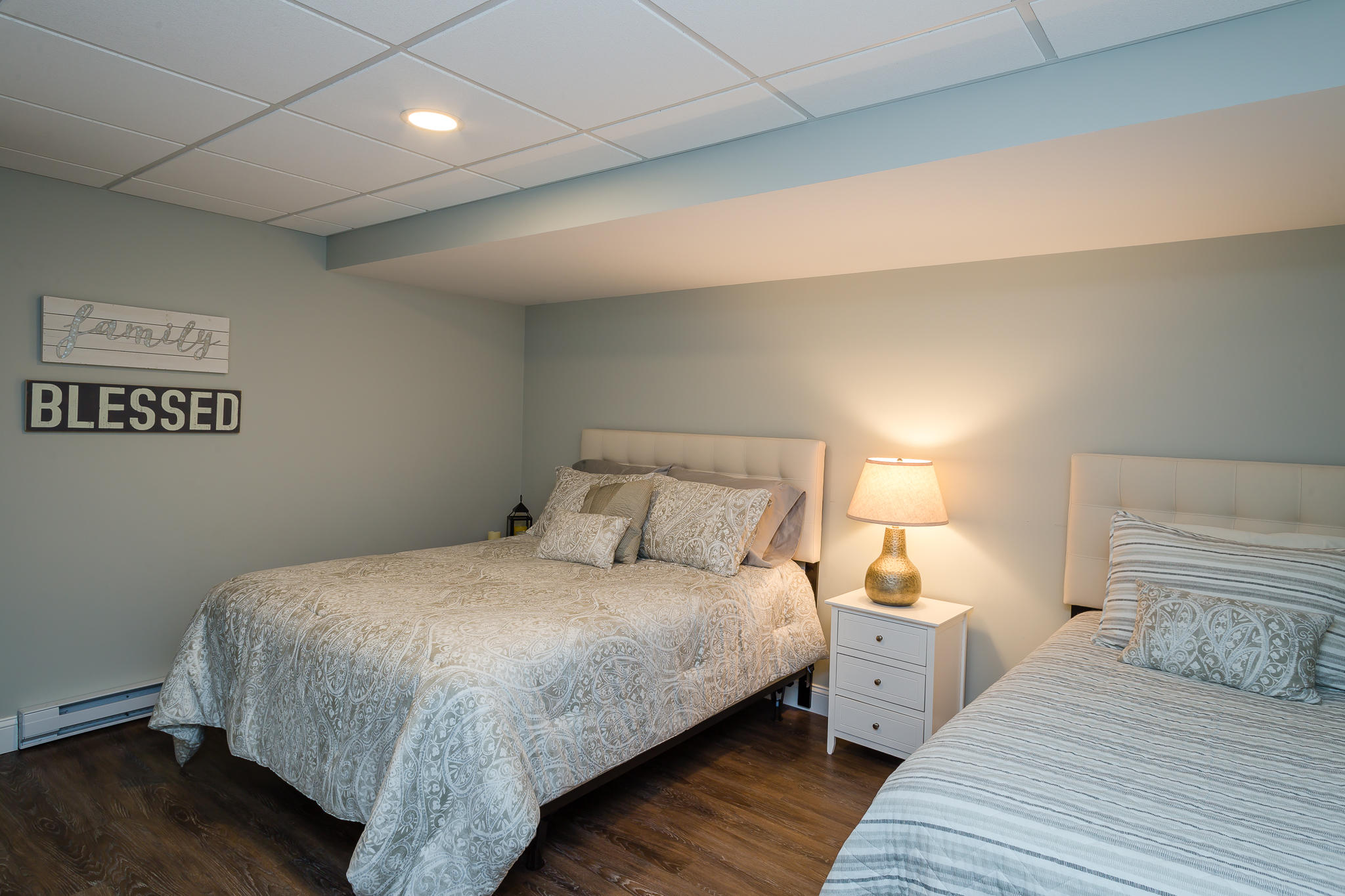 85 Palmer Road Mashpee, MA 02649 - Photo 29 of 38 a bedroom with a bed and wooden floor