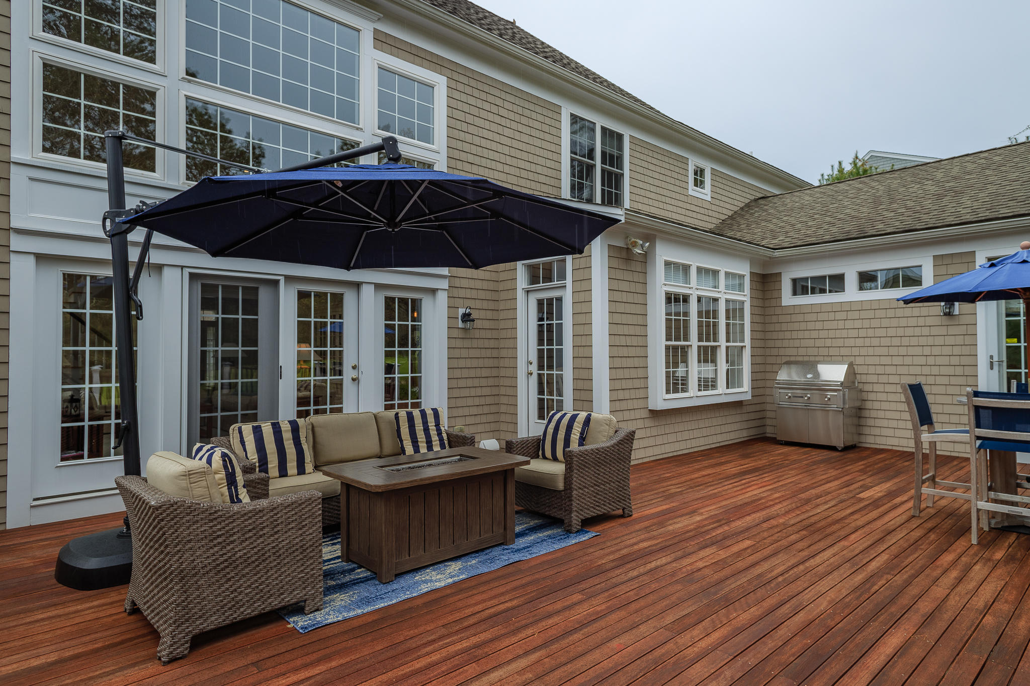 85 Palmer Road Mashpee, MA 02649 - Photo 30 of 38 a view of a patio with couches chairs and wooden floor