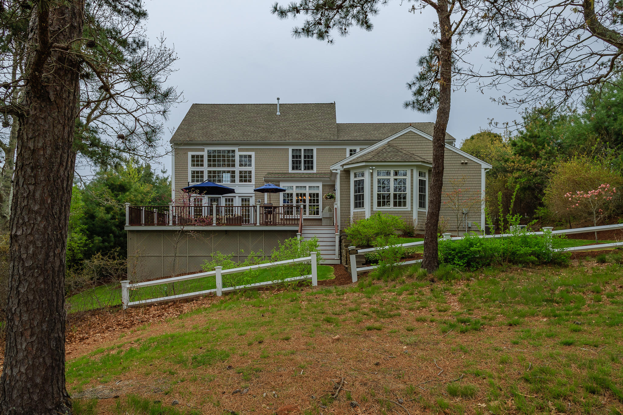 85 Palmer Road Mashpee, MA 02649 - Photo 34 of 38 front view of a house with a yard