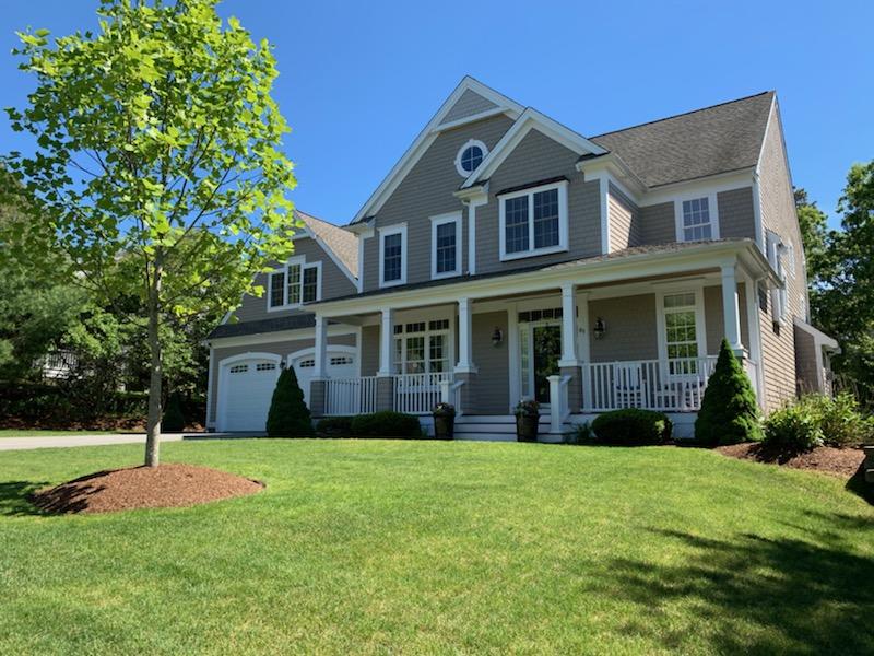 85 Palmer Road Mashpee, MA 02649 - Photo 35 of 38 a front view of a house with a yard and trees