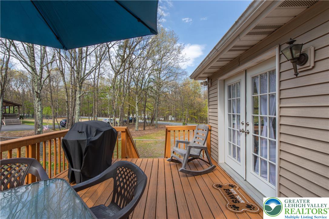 107 Shenkel Road Effort, PA 18330 - Photo 7 of 44 a view of a balcony with chairs and wooden floor