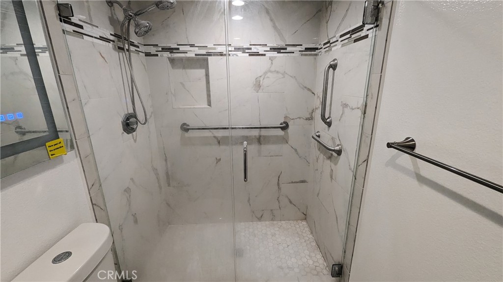 14363 Auburn Court Chino Hills, CA 91709 - Photo 13 of 27 a bathroom with a shower and a toilet