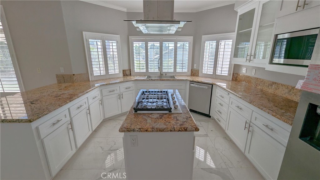 14363 Auburn Court Chino Hills, CA 91709 - Photo 2 of 27 a large kitchen with granite countertop lots of counter space and windows