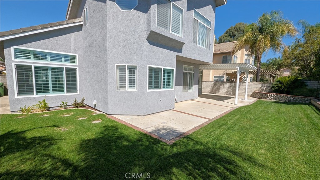 14363 Auburn Court Chino Hills, CA 91709 - Photo 27 of 27 a backyard of a house with a garden and barbeque oven
