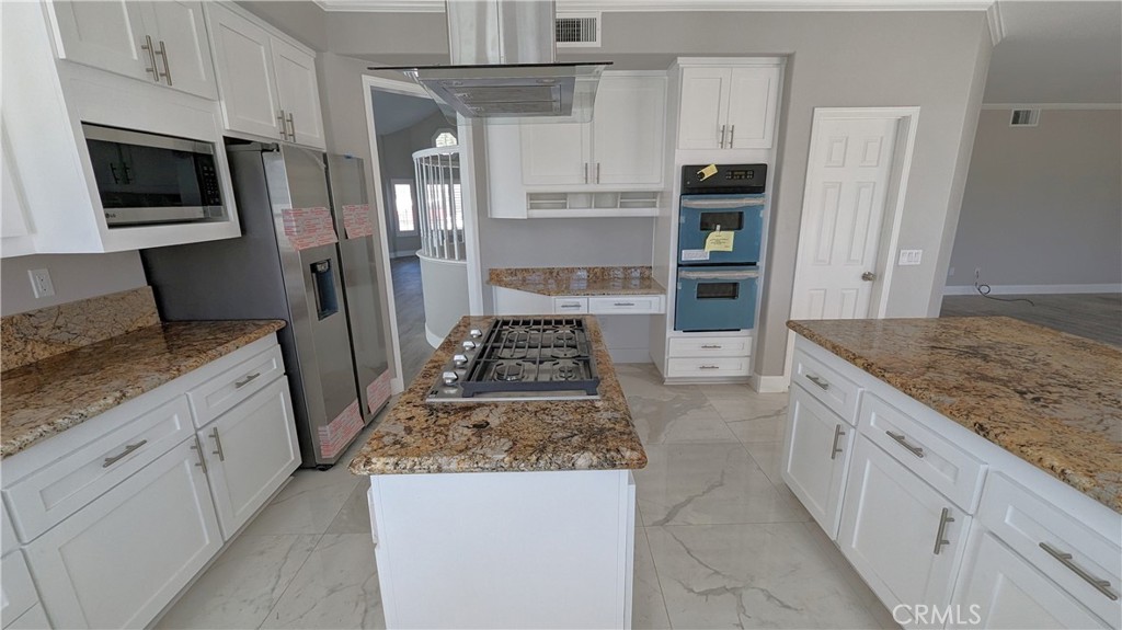 14363 Auburn Court Chino Hills, CA 91709 - Photo 4 of 27 a kitchen with stainless steel appliances granite countertop a refrigerator and a stove