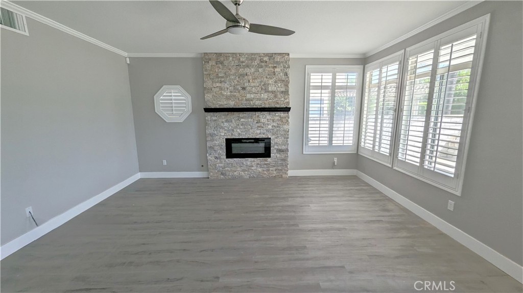 14363 Auburn Court Chino Hills, CA 91709 - Photo 6 of 27 wooden floor fireplace and windows in an empty room