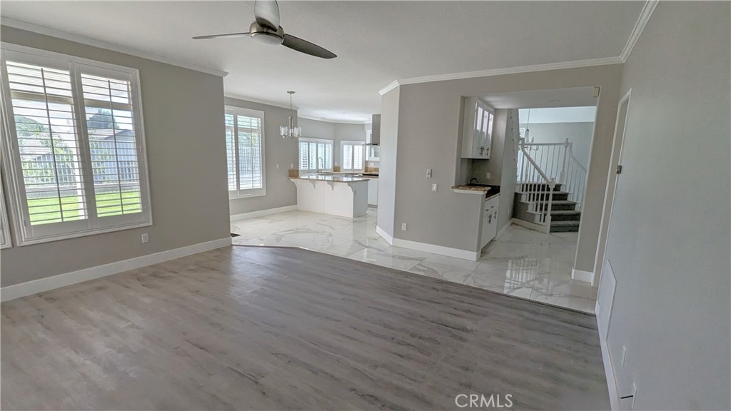 14363 Auburn Court Chino Hills, CA 91709 - Photo 7 of 27 a view of a big room with wooden floor and windows
