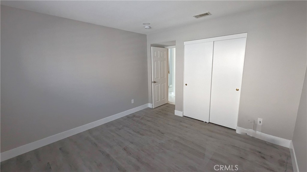 14363 Auburn Court Chino Hills, CA 91709 - Photo 10 of 27 a view of an empty room with wooden floor